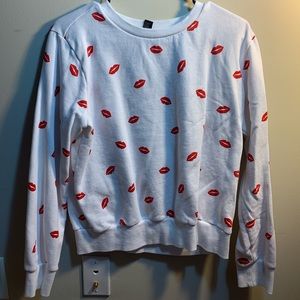 white sweater with red lips